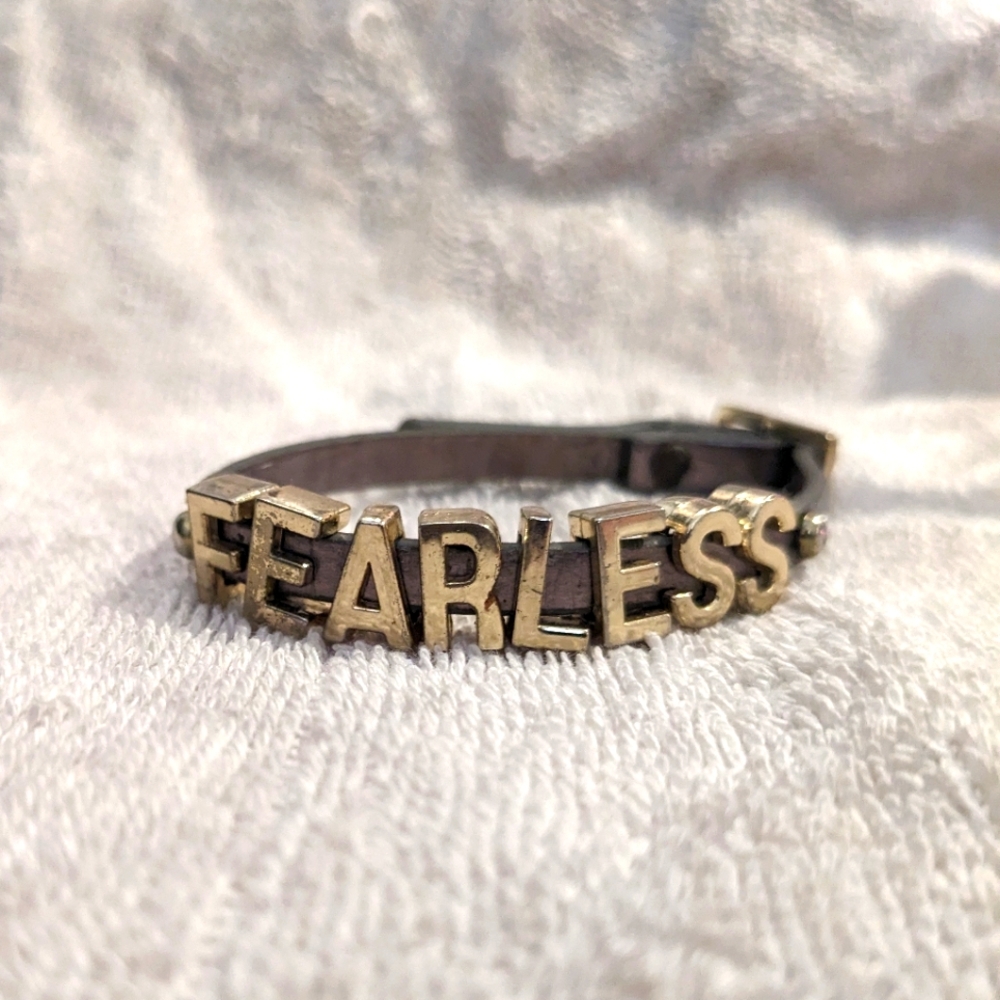 BCBG "Fearless" letters on leather strap buckle bracelet